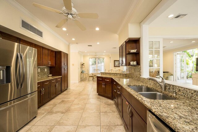 202 Admirals Ln, Key West, FL 33040 - kitchen featuring stainless steel appliances, a sink, open shelves, ceiling fan, and backsplash