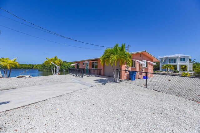 view of front of home featuring a water view