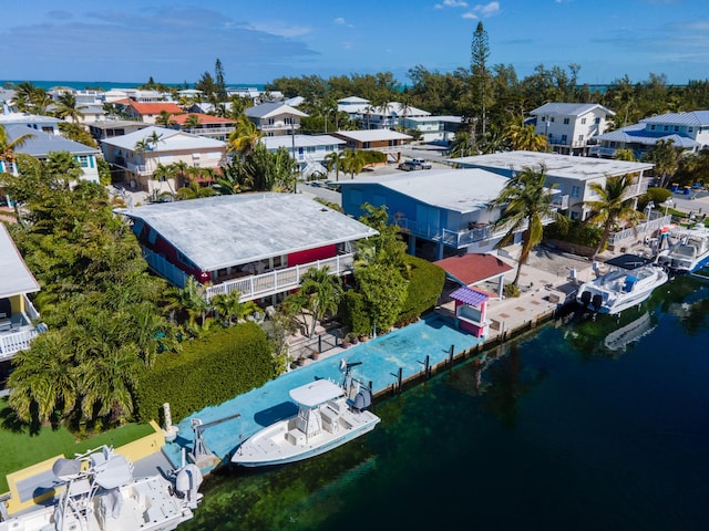 aerial view featuring a water view and a residential view