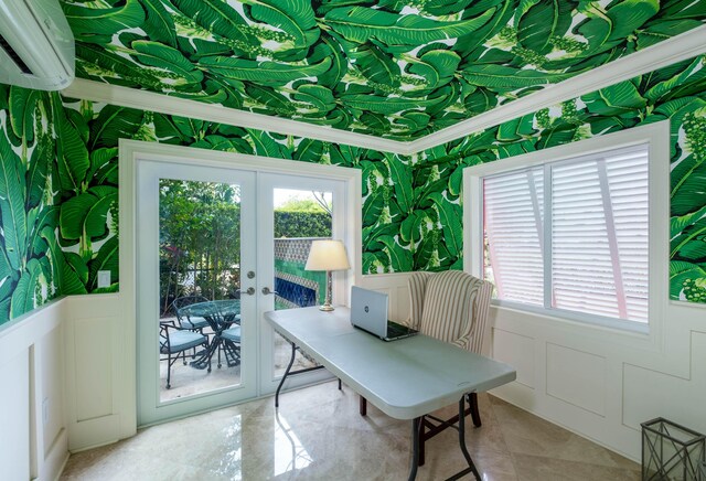 office space featuring crown molding, an AC wall unit, and french doors