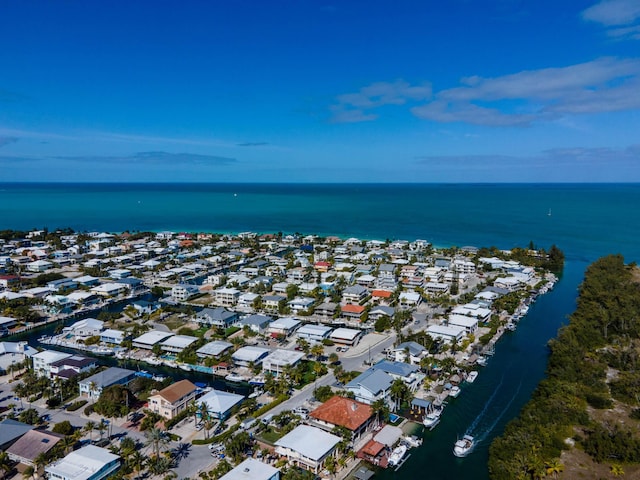 birds eye view of property featuring a water view and a residential view