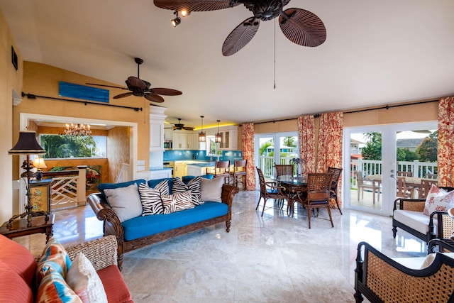 interior space with marble finish floor and ceiling fan with notable chandelier