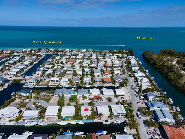 bird's eye view with a residential view and a water view