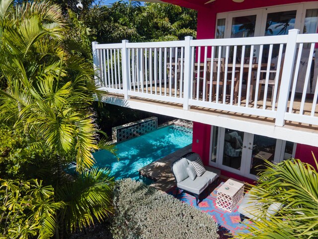 wooden deck featuring french doors