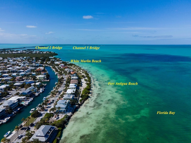 bird's eye view featuring a beach view and a water view