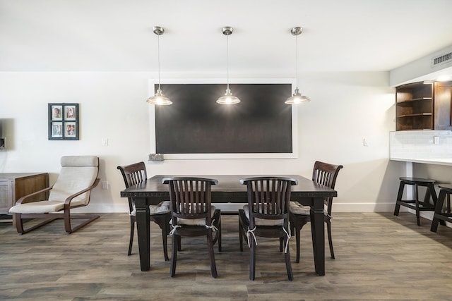 dining room featuring dark hardwood / wood-style flooring