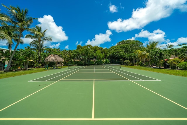 view of sport court with a gazebo and basketball hoop