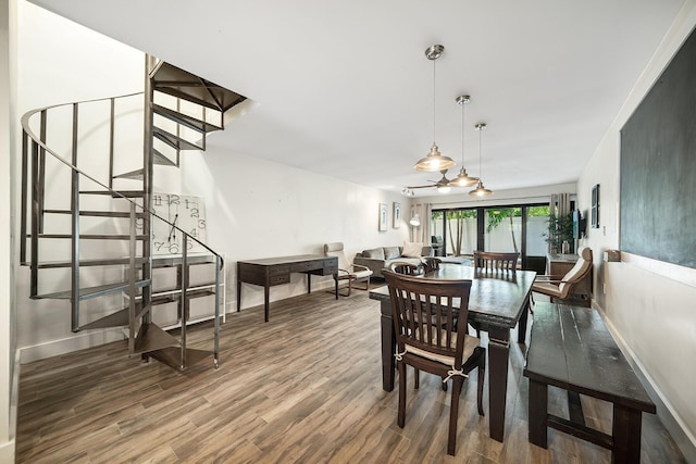 dining space with dark wood-type flooring