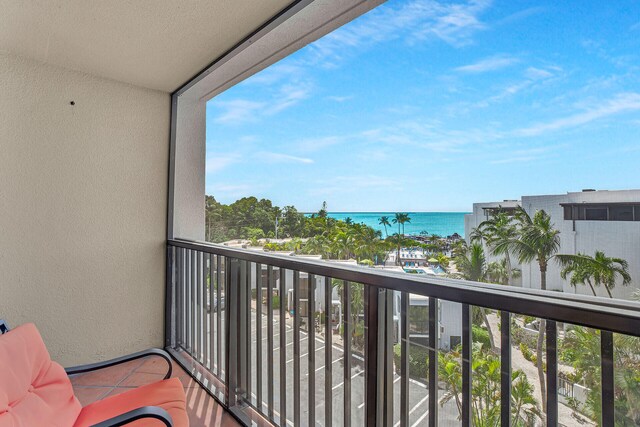 balcony featuring a water view