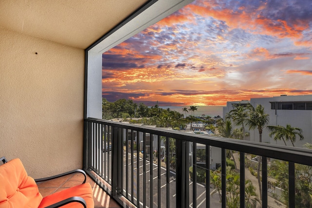 balcony at dusk with a water view