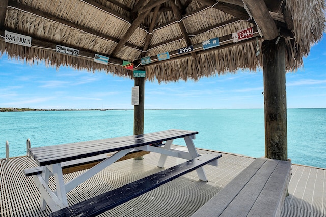 dock area with a gazebo and a water view