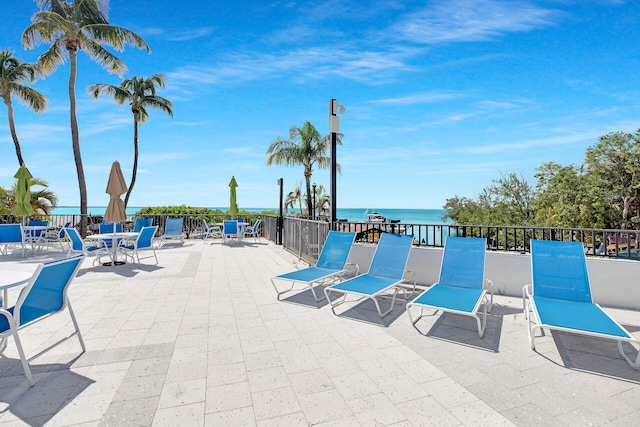 view of patio with a water view