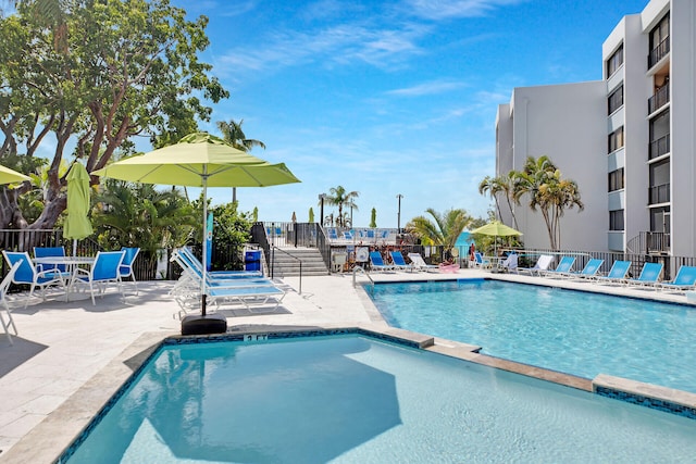 view of swimming pool featuring a patio