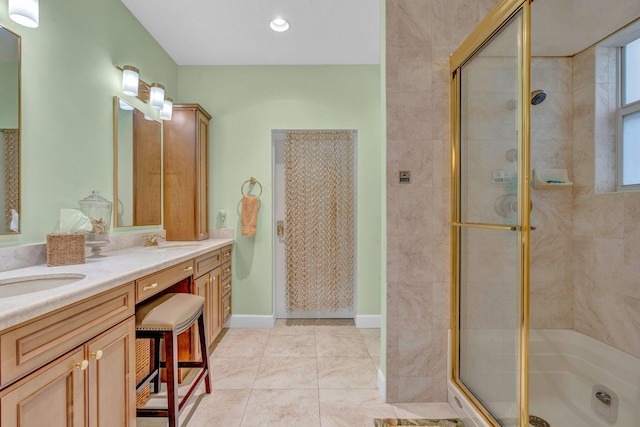 bathroom featuring vanity and a shower with shower door