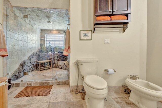 bathroom featuring a bidet, an enclosed shower, and toilet