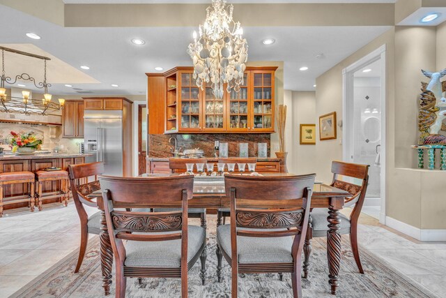 dining room with a notable chandelier