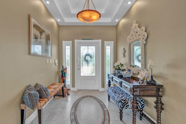 foyer featuring a tray ceiling