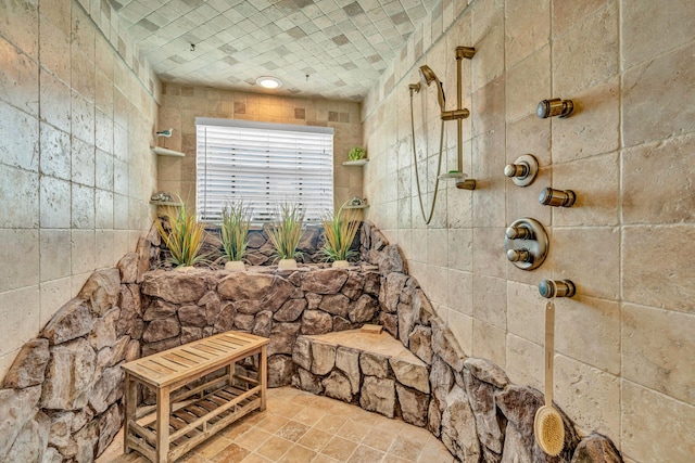 bathroom featuring a tile shower