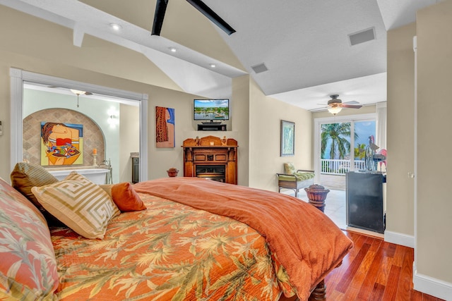 bedroom with ceiling fan, lofted ceiling, access to exterior, and light wood-type flooring