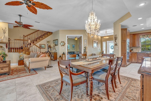 tiled dining space featuring ceiling fan