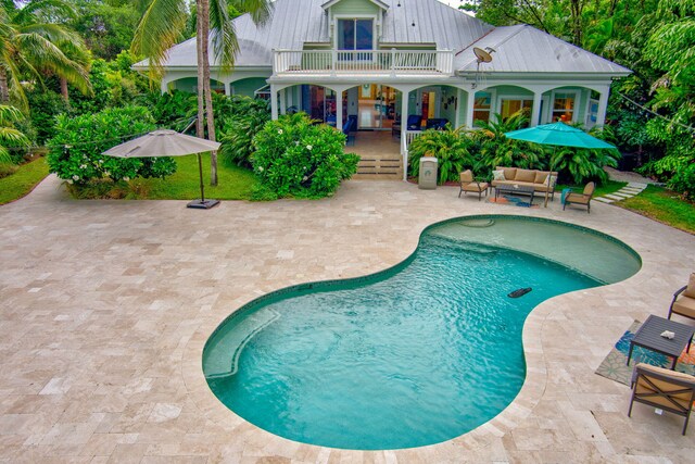 view of pool with a patio and an outdoor hangout area