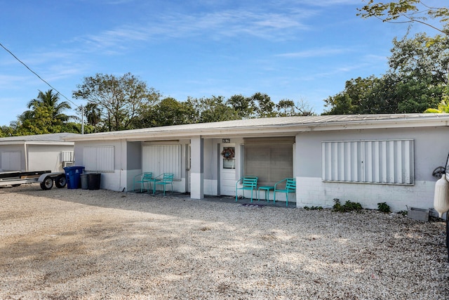 view of front of home featuring concrete block siding