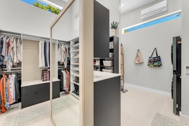 walk in closet with a wall mounted AC