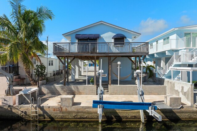 rear view of property featuring a water view