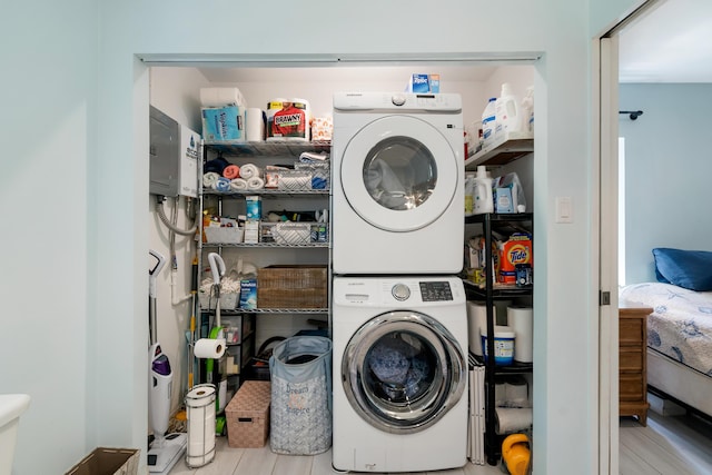 217 Gasparilla Dr, Key Largo, FL 33037 - laundry room featuring stacked washer / dryer and electric panel