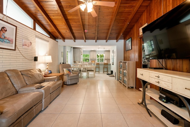 217 Gasparilla Dr, Key Largo, FL 33037 - living room with wooden ceiling, wood walls, ceiling fan, brick wall, and light tile patterned flooring