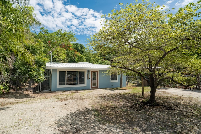 217 Gasparilla Dr, Key Largo, FL 33037 - view of front of property with stucco siding and a metal roof