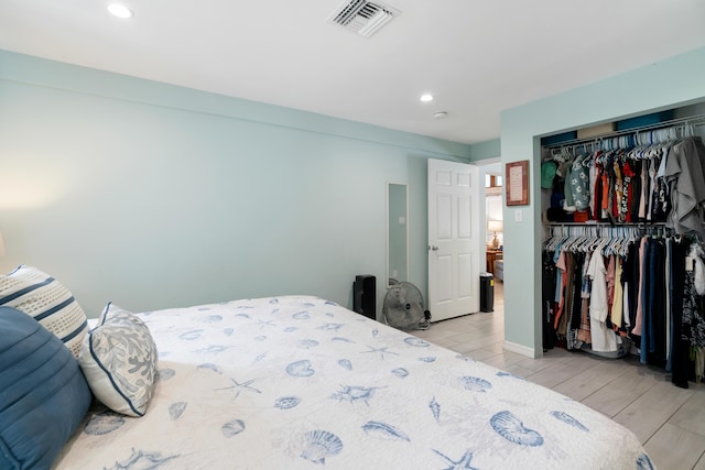 217 Gasparilla Dr, Key Largo, FL 33037 - bedroom featuring wood finish floors, a closet, and recessed lighting