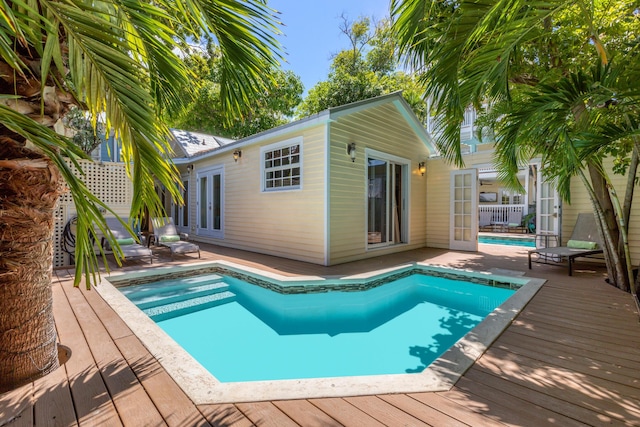 525 Simonton St, Key West, FL 33040 - swimming pool featuring a wooden deck and french doors
