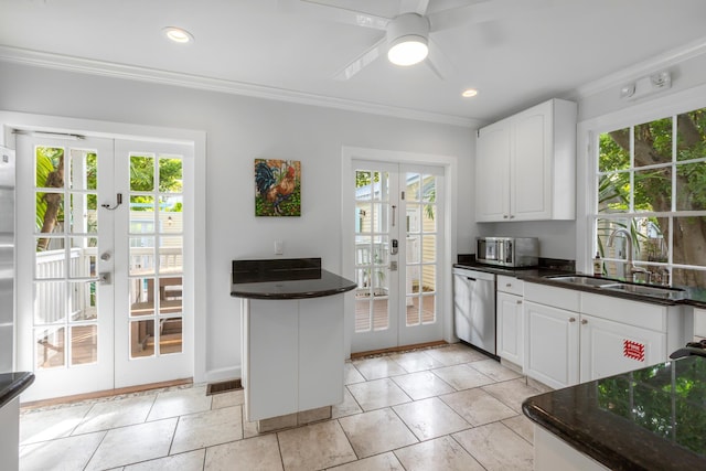 525 Simonton St, Key West, FL 33040 - kitchen featuring french doors, stainless steel appliances, crown molding, white cabinetry, and ceiling fan