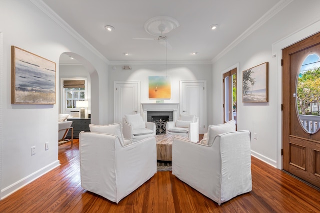 525 Simonton St, Key West, FL 33040 - living room with wood finished floors, crown molding, recessed lighting, arched walkways, and a fireplace