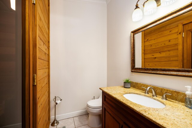 bathroom with vanity, tile patterned floors, and toilet