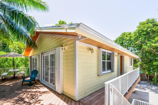 view of property exterior featuring a deck