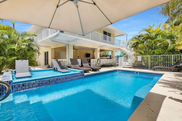 view of swimming pool with a patio area