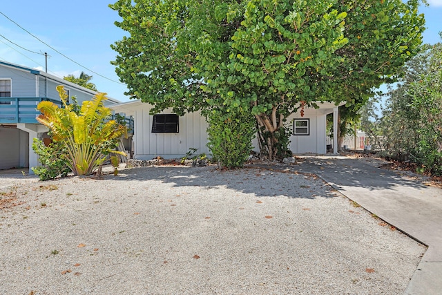 178 Coral Ave, Tavernier, FL 33070 - obstructed view of property featuring board and batten siding