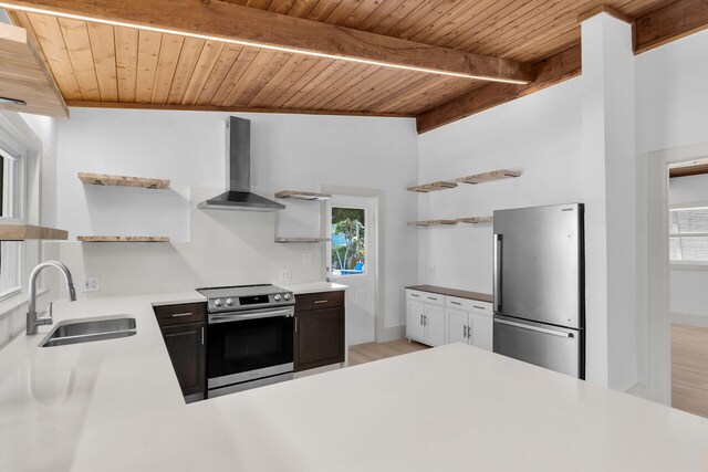 178 Coral Ave, Tavernier, FL 33070 - kitchen with open shelves, stainless steel appliances, wall chimney exhaust hood, a wooden ceiling with exposed beams, and light countertops