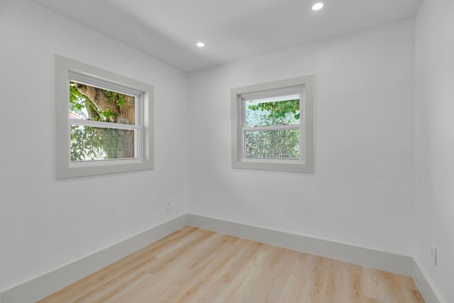 178 Coral Ave, Tavernier, FL 33070 - empty room with healthy amount of natural light, wood finished floors, and recessed lighting