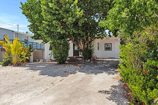 178 Coral Ave, Tavernier, FL 33070 - obstructed view of property with board and batten siding and driveway