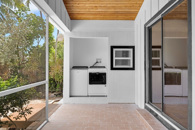 178 Coral Ave, Tavernier, FL 33070 - unfurnished sunroom featuring washing machine and clothes dryer