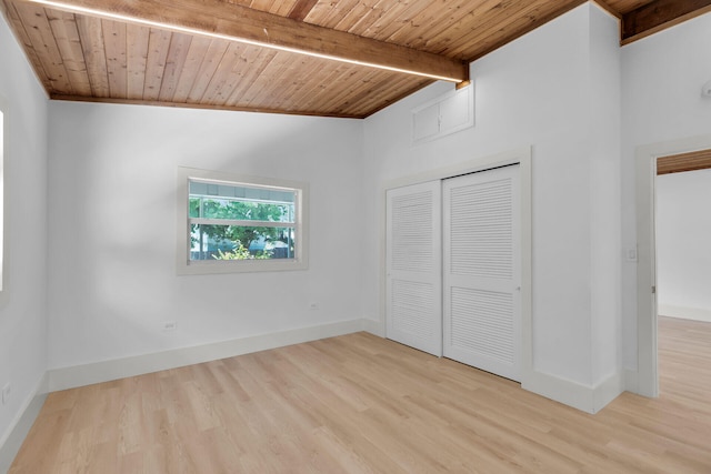 178 Coral Ave, Tavernier, FL 33070 - unfurnished bedroom featuring a wood ceiling with exposed beams, light wood-type flooring, and a closet