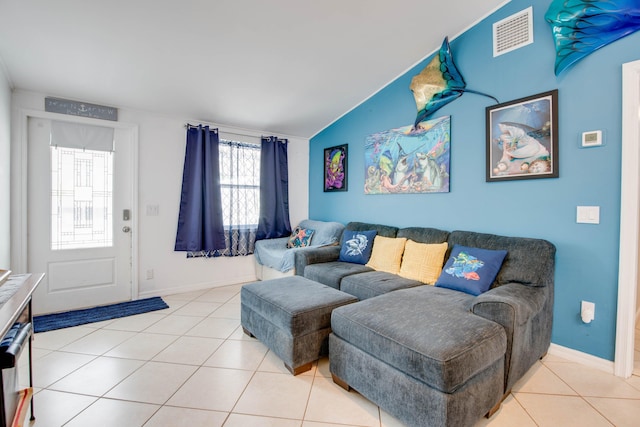 30957 Mercedes Rd, Big Pine, FL 33043 - tiled living area featuring vaulted ceiling and baseboards
