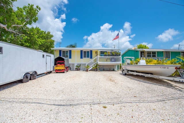 30957 Mercedes Rd, Big Pine, FL 33043 - manufactured / mobile home featuring covered porch