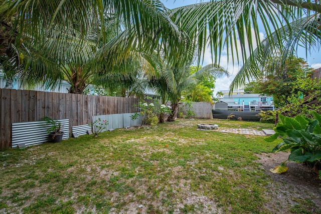 30957 Mercedes Rd, Big Pine, FL 33043 - fenced backyard with a fire pit