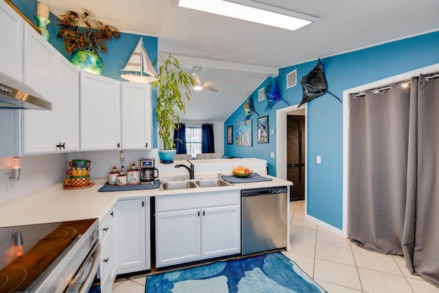 30957 Mercedes Rd, Big Pine, FL 33043 - kitchen with stainless steel dishwasher, white cabinetry, and light tile patterned flooring