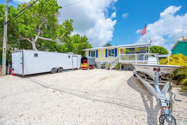 30957 Mercedes Rd, Big Pine, FL 33043 - view of front facade with a porch