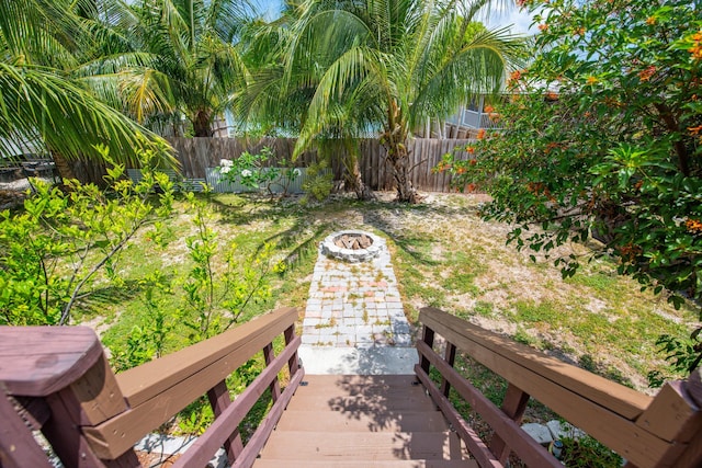 30957 Mercedes Rd, Big Pine, FL 33043 - fenced backyard featuring an outdoor fire pit